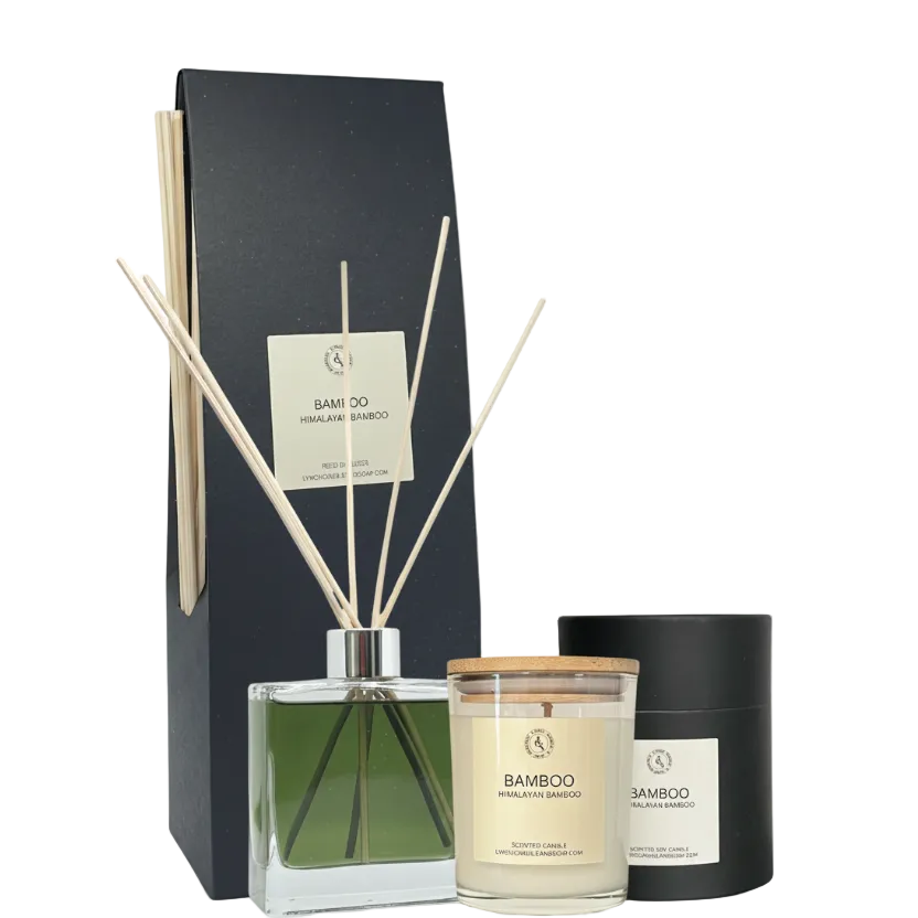 Set of bamboo-themed diffuser, candle, and reed sticks with packaging on a white background