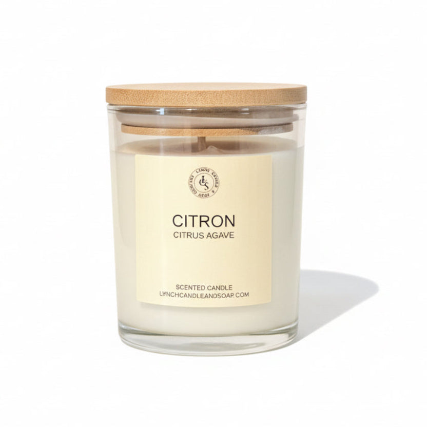 Candle with a wooden lid and 'Citron' label on a neutral background