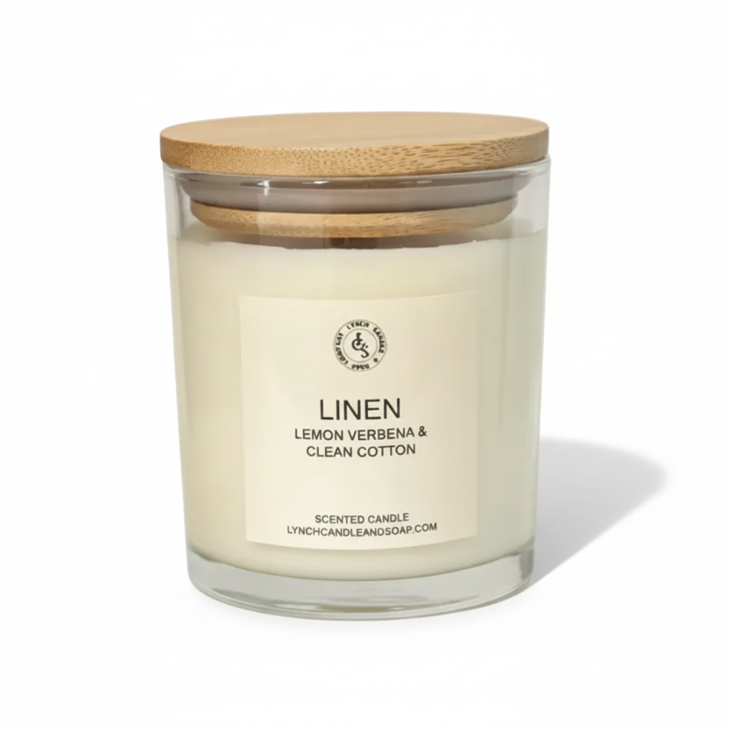 Glass candle with wooden lid labeled 'Linen' on a white background