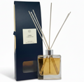 linen Reed diffuser set with packaging and cotton branches on a white background